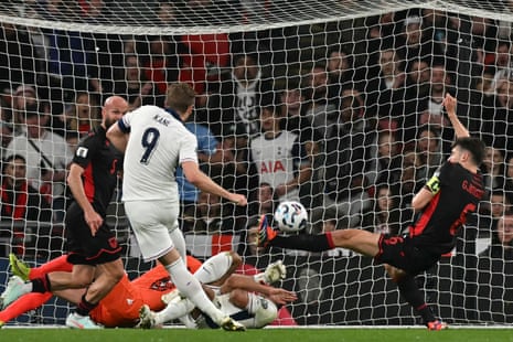 Albania's defender Berat Djimsiti (right) blocks a shot from England's Harry Kane during their 2026 World Cup group game.