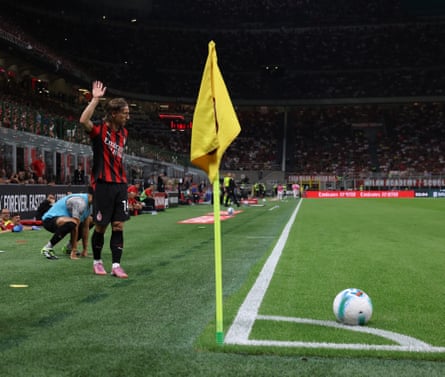 Luka Modric prepares to take a corner for Milan