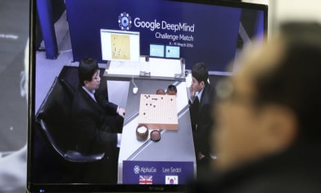 A man watches a TV screen showing Lee Sedol taking on a Google AI program in Seoul, South Korea on 9 March 2016