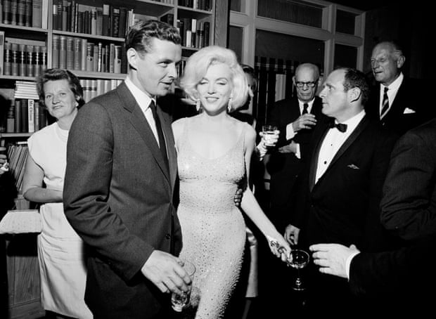 Marilyn Monroe still wearing the dress, with Steve Smith, Kennedy’s brother-in-law, at a reception at Madison Square Garden.