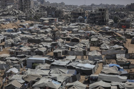 A view of Palestinian displacement camps amid widespread destruction from Israeli airstrikes in Gaza City.