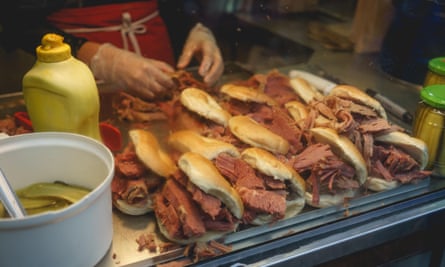 Traditional bagels with hot salt beef prepared in a bakery in Bethnal Green, London.