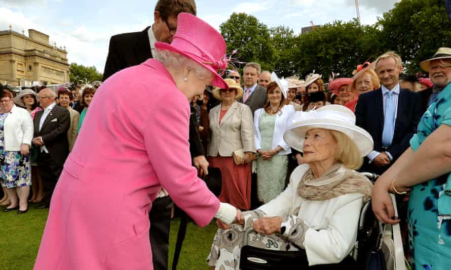 Gena Turgel is greeted by the Queen at a Buckingham Palace garden party in May 2015.