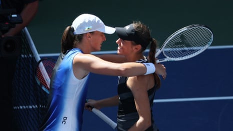 Iga Swiatek and Kaja Juvan meet at the net after their third round match.