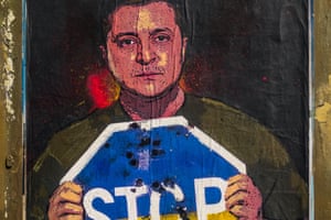 Ukrainian president Volodymyr Zelensky is depicted at a graffiti by Italian urban artist 'TVBoy', Salvatore Benintende, titled 'Stop The Madness' holding a Stop sign in the national colors in protest to the ongoing Russian attacks. The art is in Barcelona, Spain.