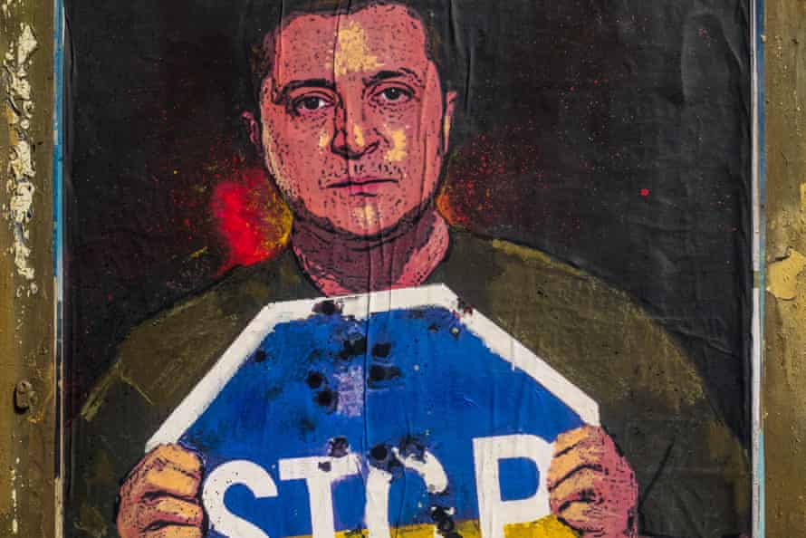 Ukrainian president Volodymyr Zelensky is depicted at a graffiti by Italian urban artist ‘TVBoy’, Salvatore Benintende, titled ‘Stop The Madness’ holding a Stop sign in the national colors in protest to the ongoing Russian attacks. The art is in Barcelona, Spain.