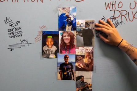 A memorial honoring unhoused people who died is seen on a wall in Los Angeles.