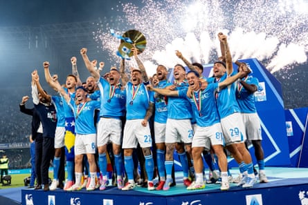 Giovanni Di Lorenzo, the captain of Napoli, lifts the Serie A trophy.