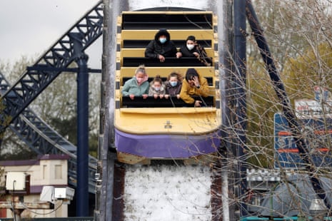 Members of the public ride on the Tidal Wave water slide ride at Thorpe Park theme park in Chertsey, southwest of London.