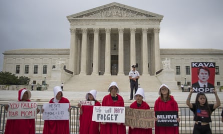 Protesters dressed as handmaids