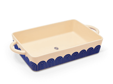 a rectangular white pan with a blue design
