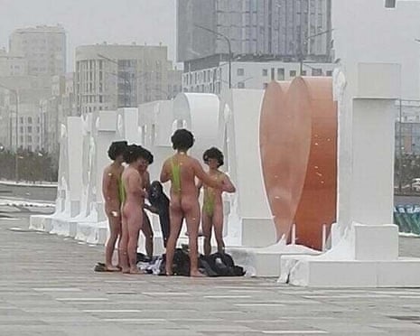 A group of Czech tourists dressed in swimsuits made famous by TV and film character Borat in Astana