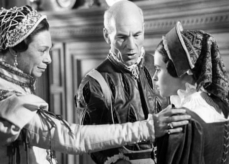 Patrick Stewart stands between Helena Bonham Carter and Sara Kestelman in Tudor-era costume