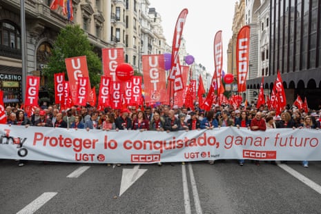 People take part in a rally marking International Labor Day, held under the motto 'Protect What Has Been Conquered, Gaining the Future,' in Madrid, Spain.