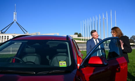 Climate change minister Chris Bowen and transport minister Catherine King with an EV