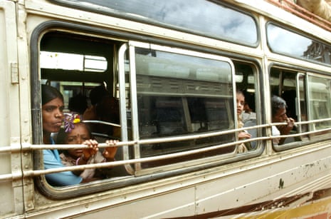 People looking from bus window in Karnataka india