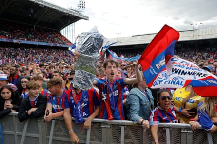 Palace fans on the pitch during FA Cup winning party on the pitch at Selhurst Park.