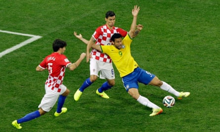 Brazil’s Fred takes a theatrical tumble at the 2014 World Cup.
