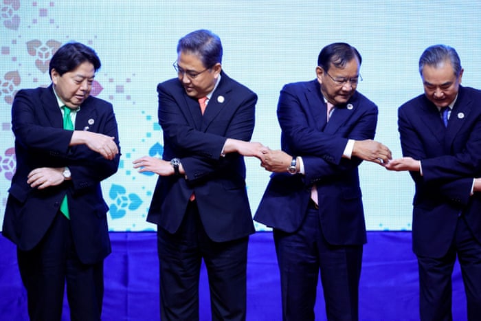 Japan’s foreign minister Yoshimasa Hayashi, South Korean foreign minister Park Jin, Cambodia’s foreign minister Prak Sokhonn and Chinese foreign minister Wang Yi pose for a group photo in Phnom Penh, Cambodia.