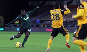 Tottenham Hotspur’s French midfielder Tanguy Ndombele (L) scores his team’s first goal.