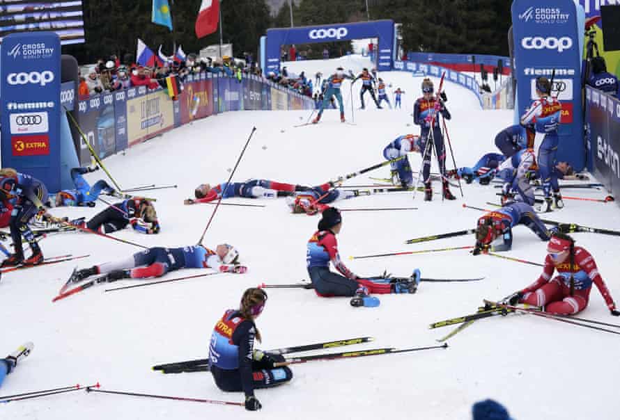Participants recover at the finish line during the Women’s Mass Start Free 10km event at the Tour de Ski in Val di Fiemme, Trento, Italy on Tuesday