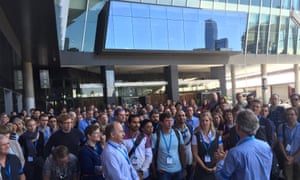 More than 200 scientists donned blue armbands at a protest against CSIRO cuts outside the Australian Meteorological and Oceanographic Society’s annual conference in Melbourne on Monday. Photo: Calla Wahlquist for Guardian Australia.