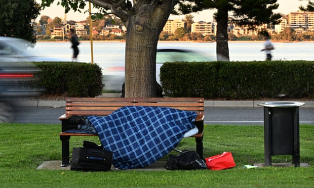 A homeless person asleep on a park bench in Perth in June this year.