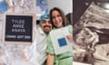 Composite of three images. On far left is stylized image of black board with white lettering saying "Tylee Anne Anaya, Coming Sept 2023." Middle are white man in blue hair net and white gown next to white woman in green gown, both smiling broadly and leaning together, with the woman holding up a piece of paper. On the right is an image of a fetus's profile on a fetal ultrasound.
