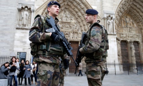 Soldiers patrol in front of the Notre Dame Cathedral in Paris after last Friday’s attacks.