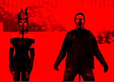 Mariqueen Maandig and Trent Reznor of Nine Inch Noize perform in the Sahara Tent with a red background