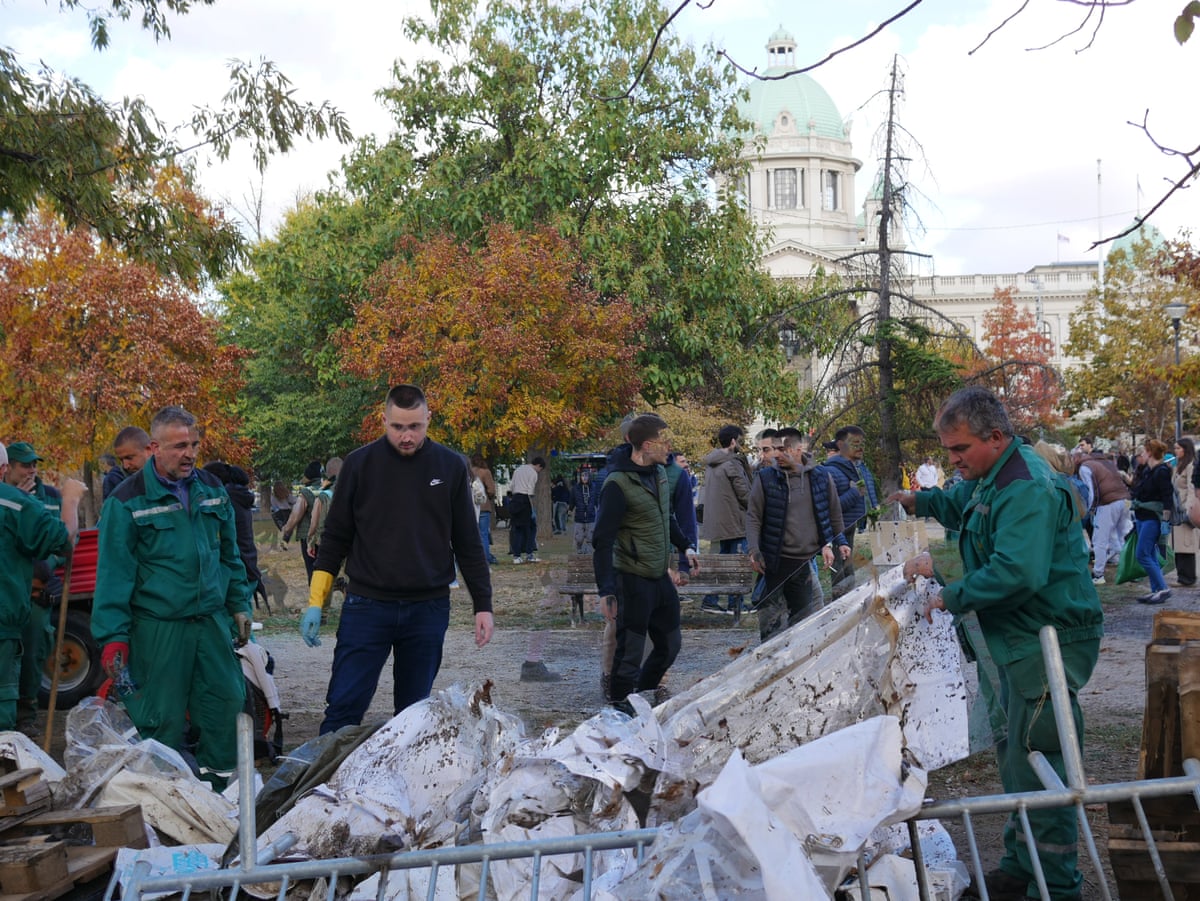 Volunteers join municipal workers to clear away makeshift tents