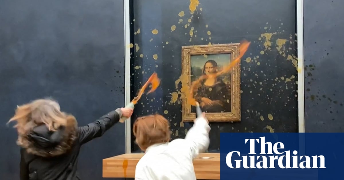 Moment protesters throw soup at Mona Lisa in Paris – video | Art and design
