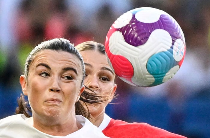 Ingrid Engen watches the ball as she battles with Austrian defender Laura Wienroither.