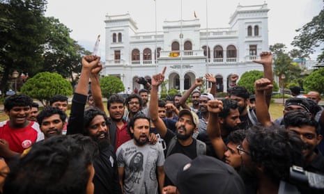 Protesters cheer and shout slogans after the resignation of Sri Lankan president Gotabaya Rajapaksa