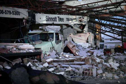 Damage is seen to the Sinnott Tree Service building after a tornado touched down Wednesday evening near Chicago’s O’Hare International Airport