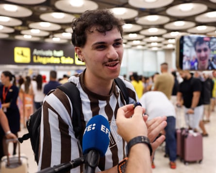A passenger speaks with members of the media upon arrival from Italy at Adolfo Suarez Barajas Airport in Madrid, Spain.