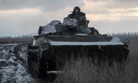 Ukrainian service members on a BMP-1 infantry fighting vehicle near the front line city of Vuhledar on 22 February.