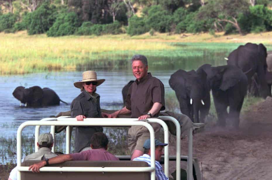 Then first lady Hillary Clinton and President Bill Clinton watch as a herd of elephants drink on the banks of the Chobe River in Chobe National Park in 1998.