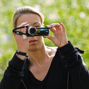 Woman using a digital movie camera