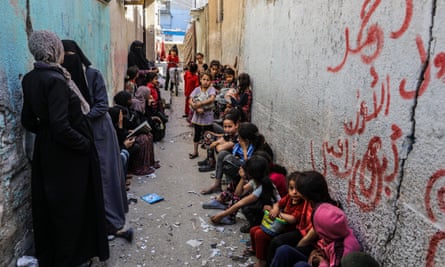 People queuing for hot food in Rafah