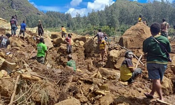 Locals digging at the site of a landslide at Yambali village in the region of Maip Mulitaka, in Papua New Guinea's Enga Province