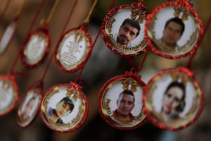 Christmas decorations with the photographs and names of disappeared people in Mexico.