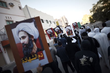 Bahraini protesters hold placards bearing portraits of prominent Shia cleric Nimr al-Nimr during protests against his execution by Saudi authorities.