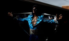 An Elvis impersonator poses before boarding the Elvis express at Central station