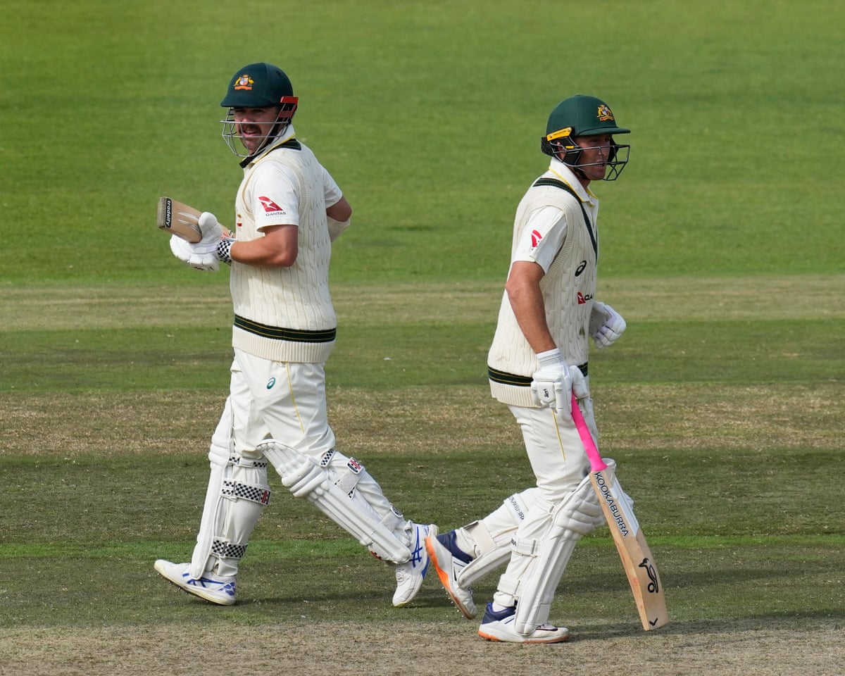 Australia batters Travis Head (left) and Marnus Labuschagne run between wickets in the second Test against South Africa
