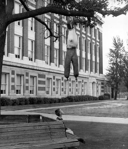 A young boy looks at an hanging effigy of a Black person placed by students in front of Maury high school in Norfolk in September 1958.
