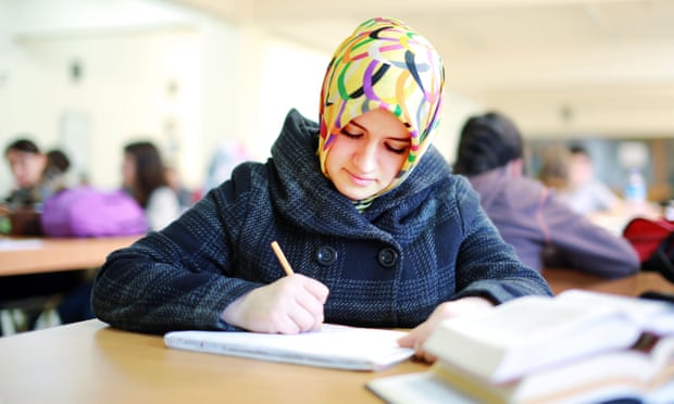 Muslim girl studying in library 2014.