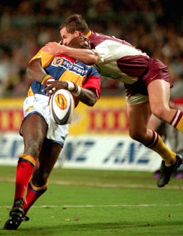 Martin Offiah is tackled during a match between Brisbane Broncos and London Broncos.