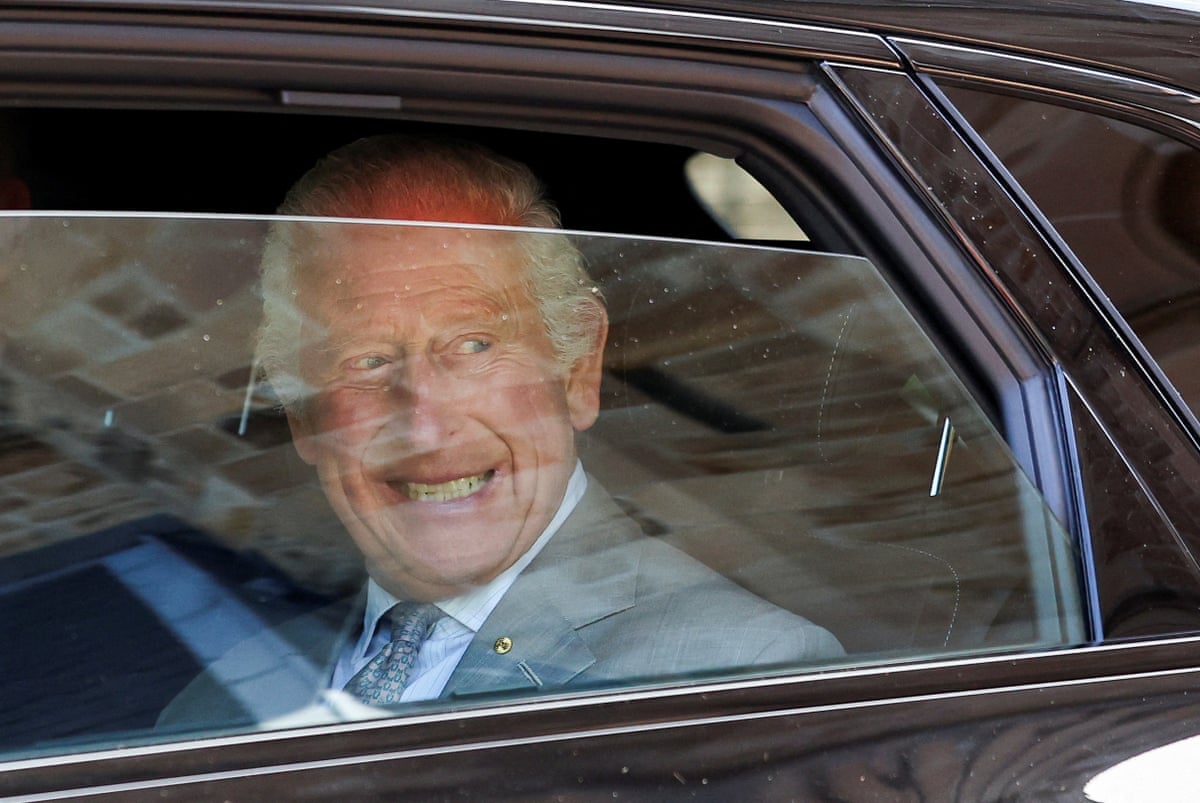 Charles in the back seat of a car