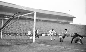 Real Madrid’s Ferenc Puskas (third right) slots home his team’s fifth goal, completing his hat-trick at Hampden.